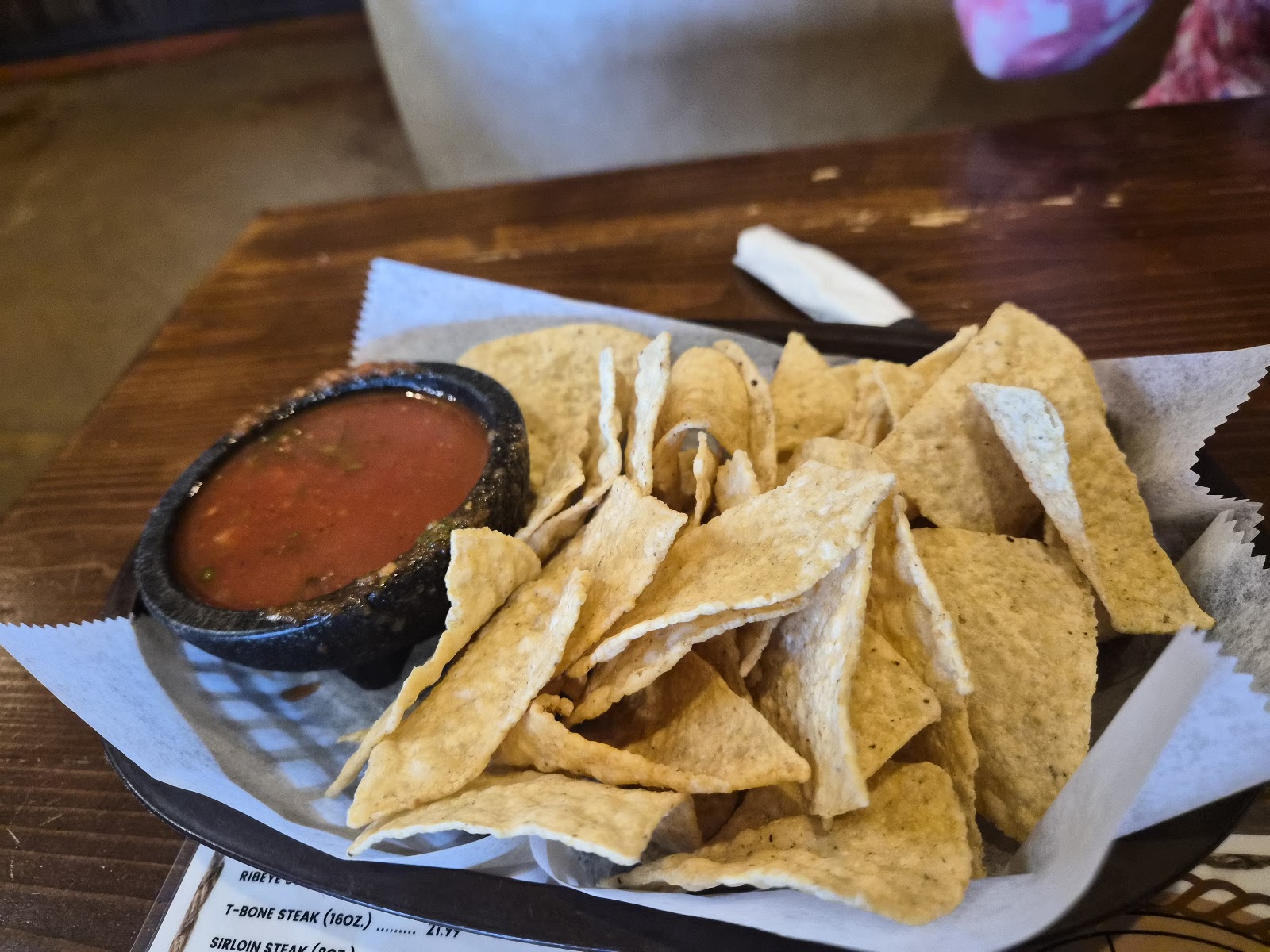 Chips and salsa served in a molcajete