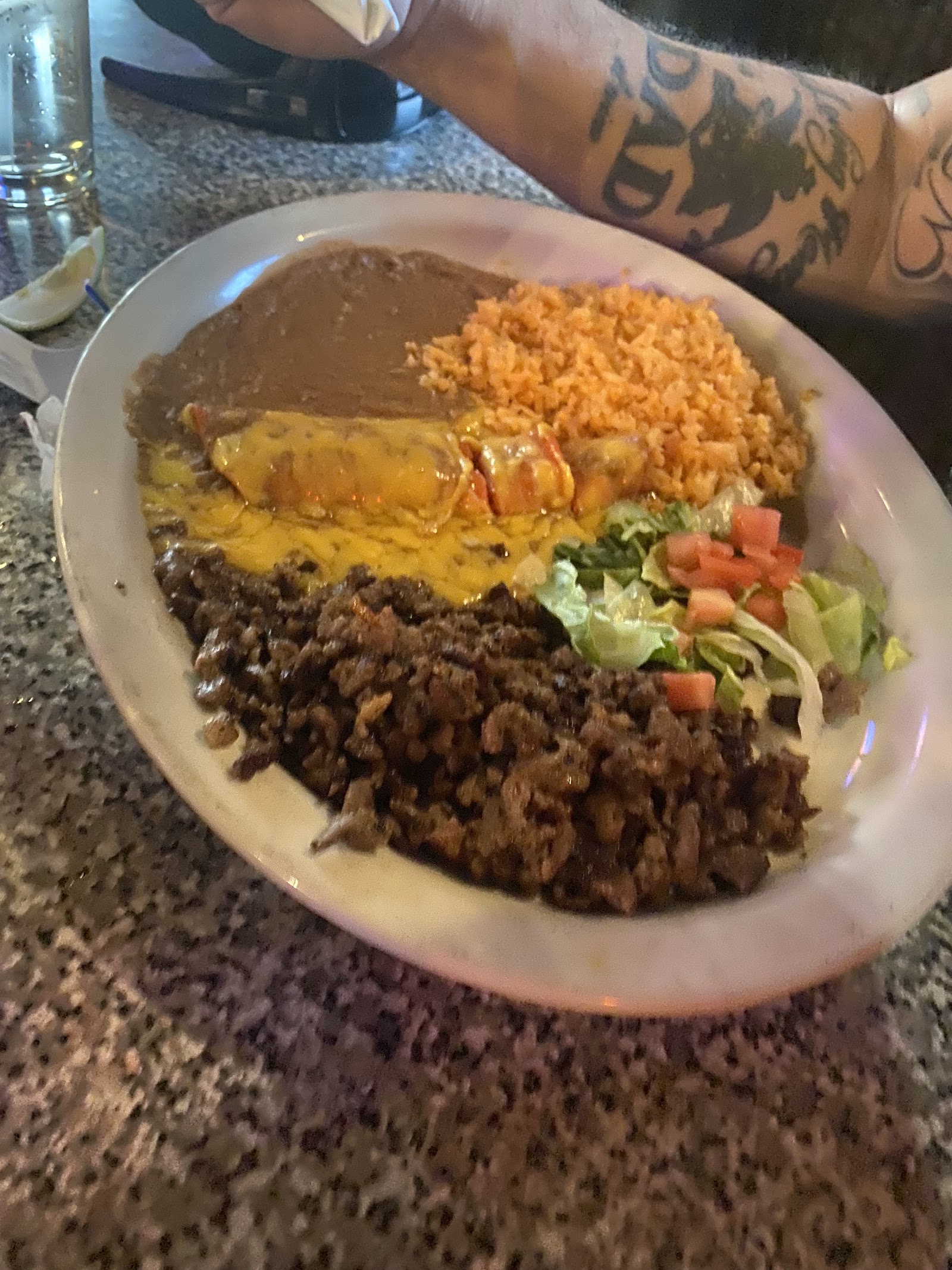 Fajita plate with rice, beans and cheese enchilada
