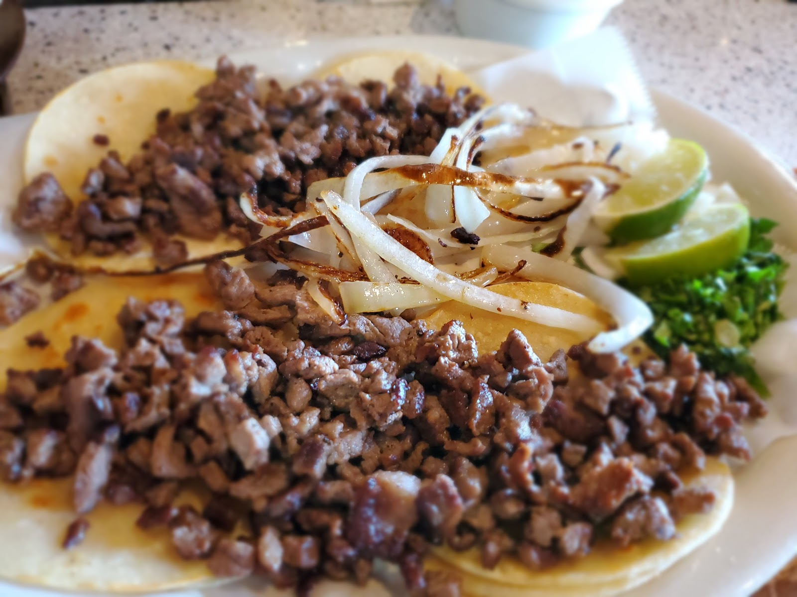 Street tacos with grilled onions, cilantro and lime
